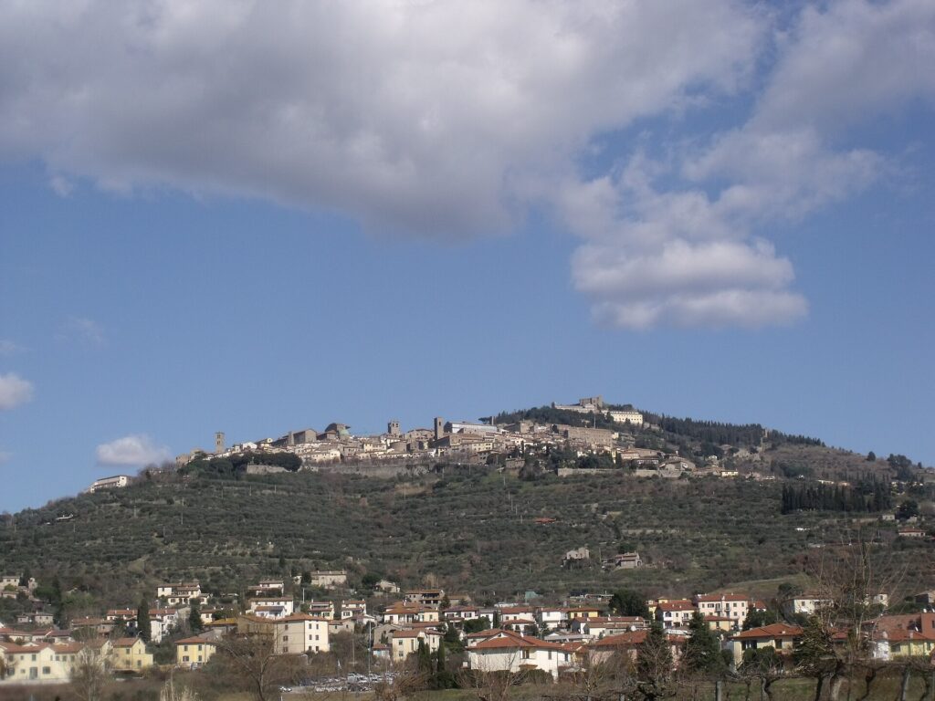 Cortona on its hillside above the olive groves and farmland of the Valdichiana