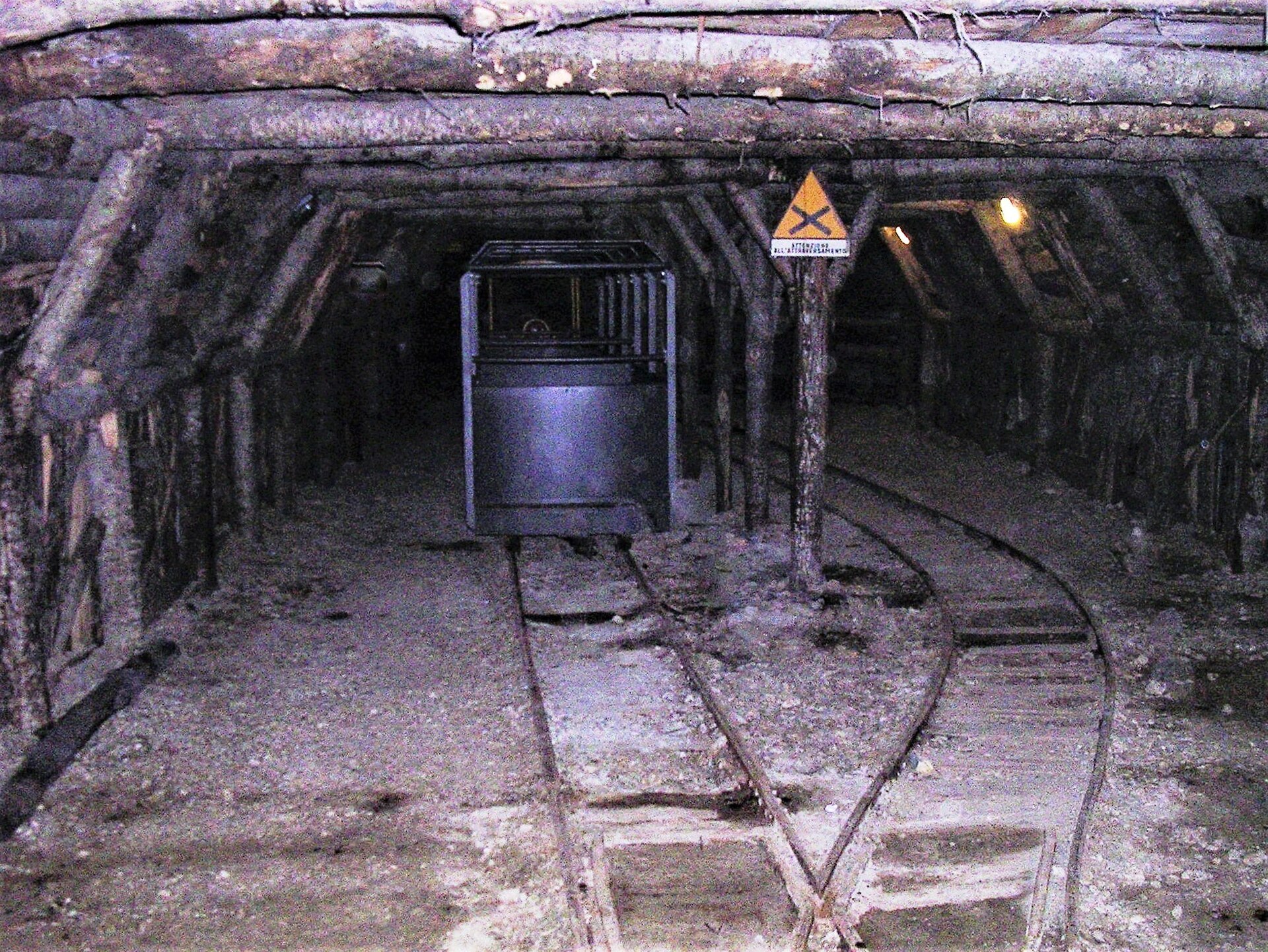 Rails and a mine cart in a gallery of the former cinnabar mine at Abbadia San Salvatore