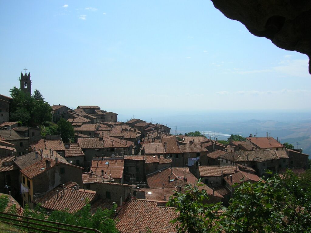 Stone houses and tiled roofs of Piancastagnaio looking out over the valley