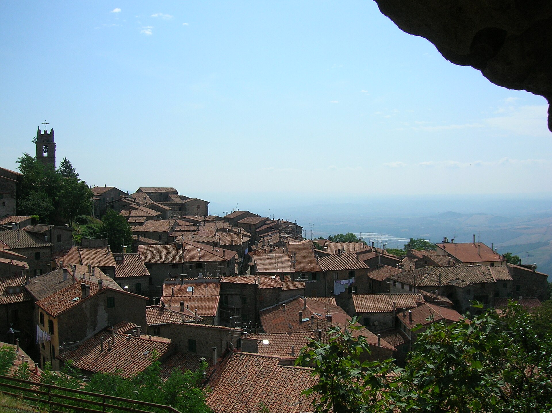 Stone houses and tiled roofs of Piancastagnaio looking out over the valley