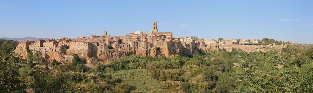 Pitigliano rising from its tufa cliff, seen from the panoramic viewpoint on the road into town