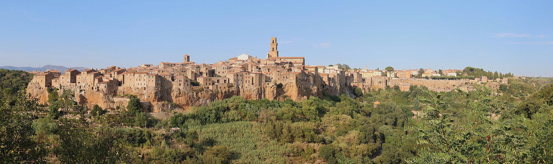 Pitigliano rising from its tufa cliff, seen from the panoramic viewpoint on the road into town