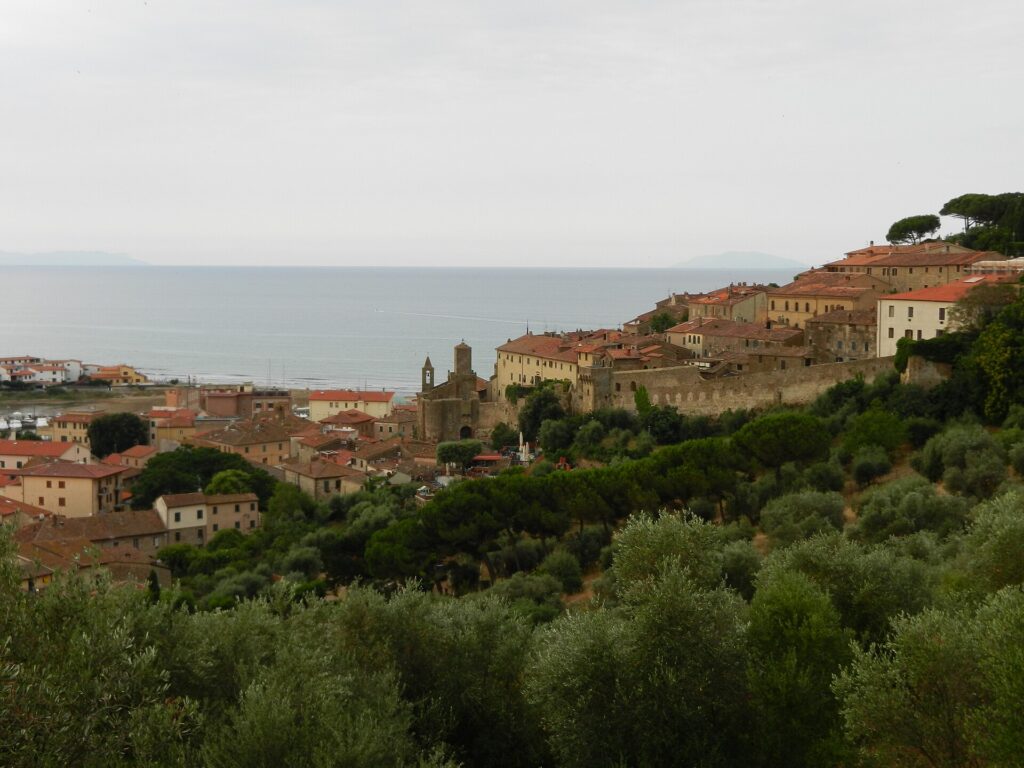 The walled hilltop borgo of Castiglione della Pescaia above the coast