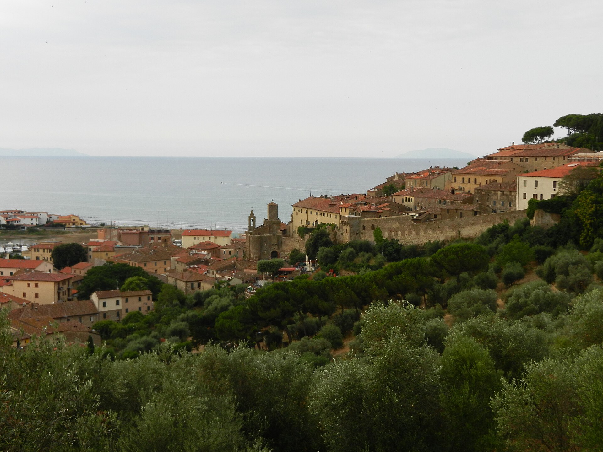The walled hilltop borgo of Castiglione della Pescaia above the coast