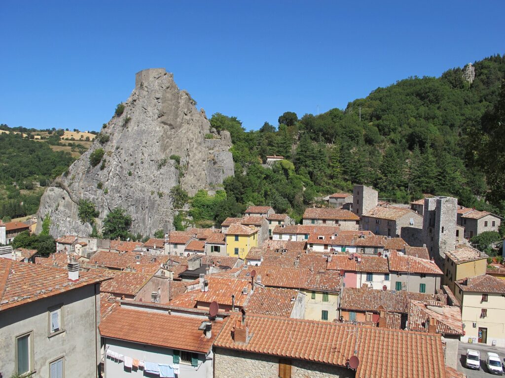 Terracotta rooftops of Roccalbegna beneath its limestone crag