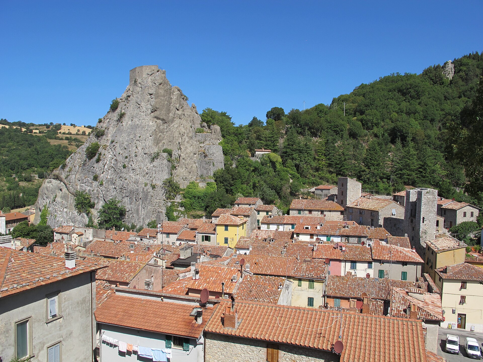 Terracotta rooftops of Roccalbegna beneath its limestone crag