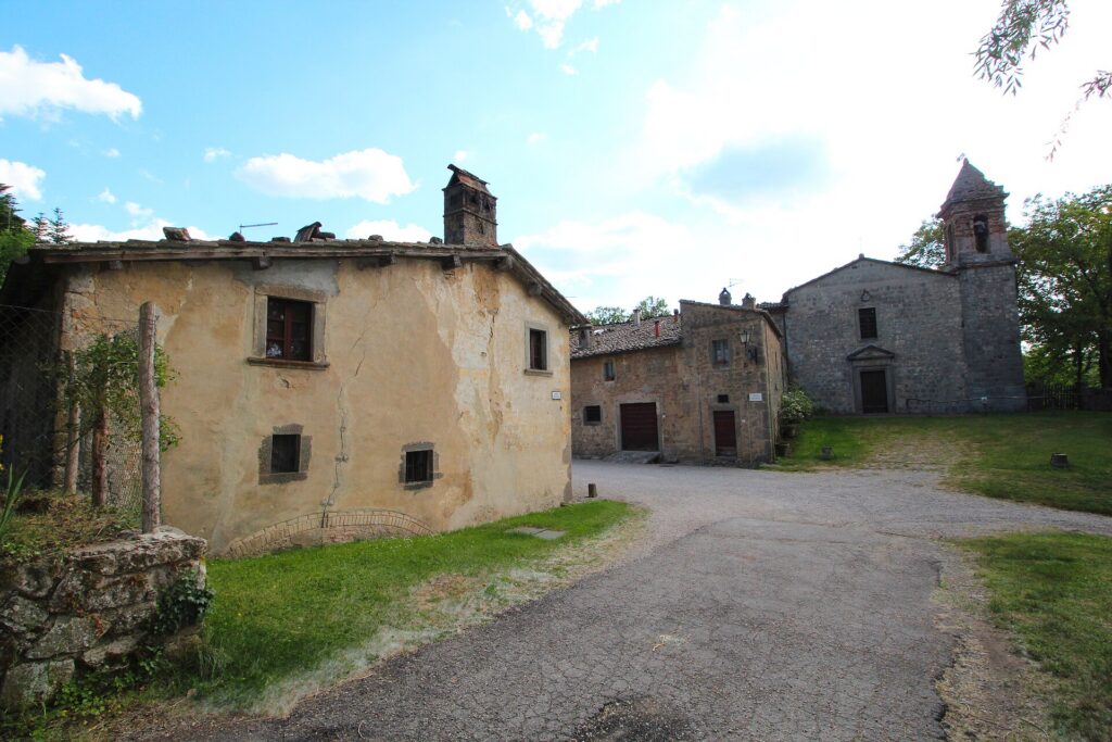 Stone buildings of the Contea hamlet at Vivo d'Orcia, with its church bell tower