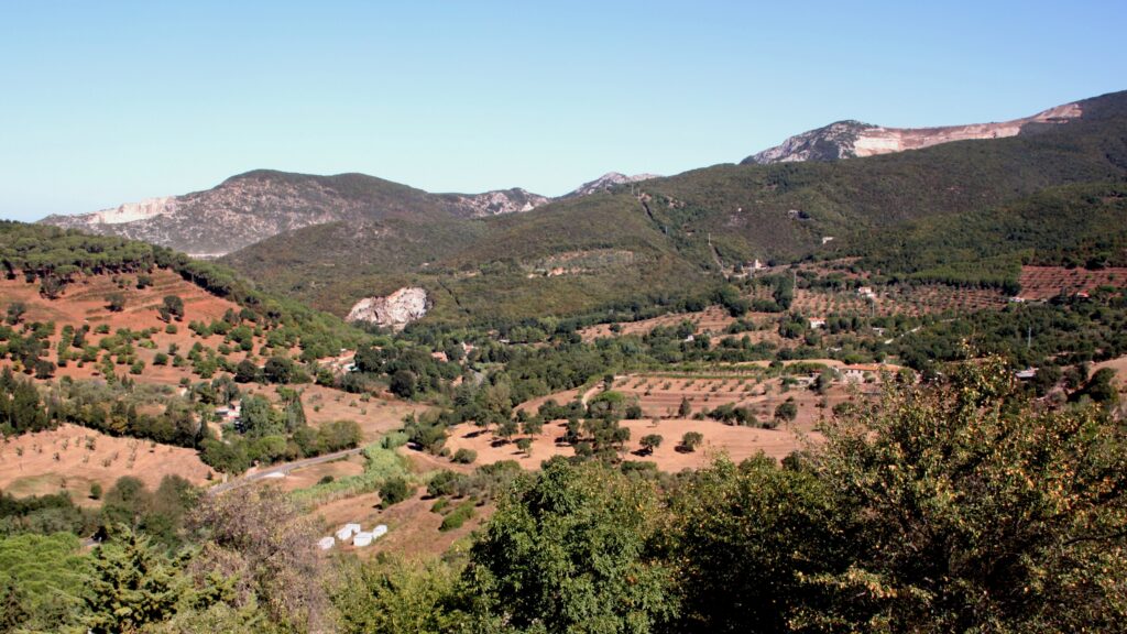 The ochre and green hills of the Colline Metallifere seen from Campiglia Marittima