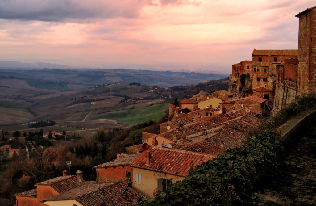 Montepulciano's rooftops at sunset above the Valdichiana