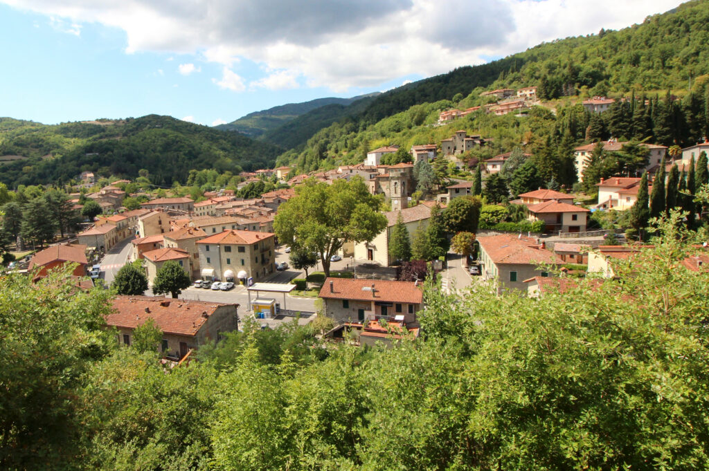 The village of Talla on a green hillside in the Casentino